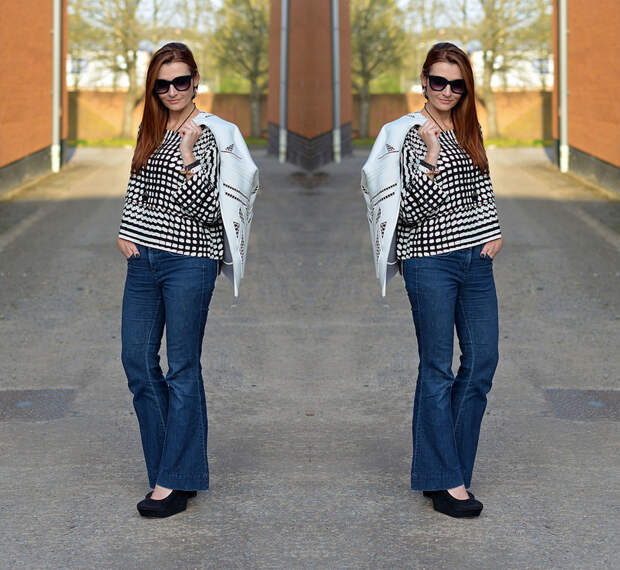 White cut out jacket, black and white boxy top, dark flared denim