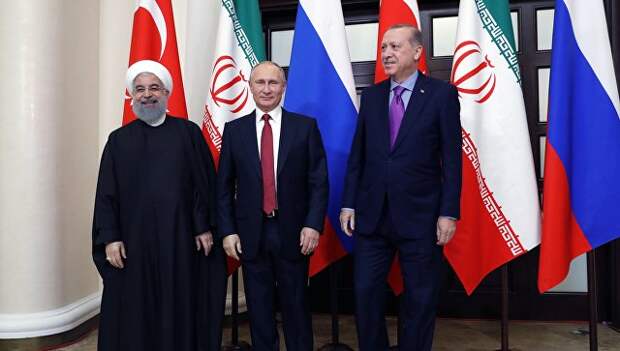 Президент РФ Владимир Путин, президент Ирана Хасан Рухани и президент Турции Реджеп Тайип Эрдоган во время встречи. 22 ноября 2017