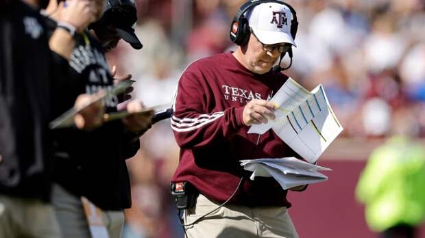 Jimbo Fisher shuffles through his playbook.