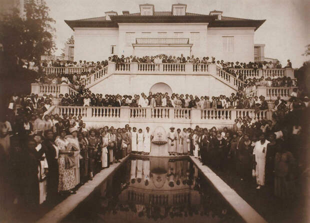 Walker hosting a gathering for her employees in the backyard.