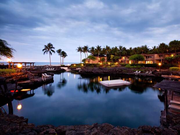 the-kings-pond-at-the-four-seasons-resort-hualalai-in-kailua-kona-hawaii-is-an-ocean-water-pool-carved-out-of-natural-lava-rocks-where-youll-find-18-million-gallons-of-water-manta-rays-and-over-3000-tropical-fish