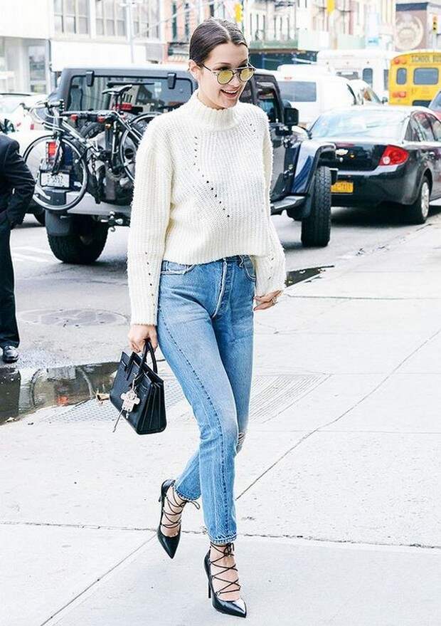 Bella Hadid suggest minimalist style girl in blue jeans skinny pants, sweaters white badger neck hug.