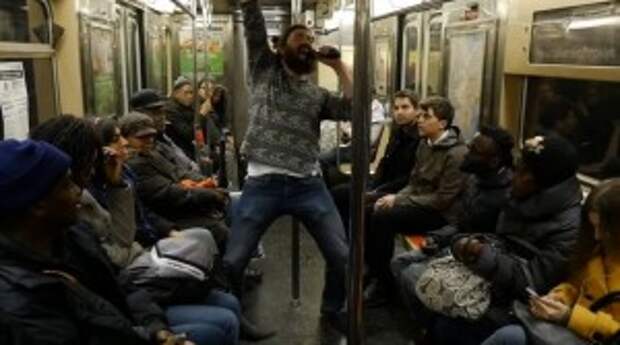 This Guy Is About to Make These Subway Commuters Forget Their Problems In the Best Way