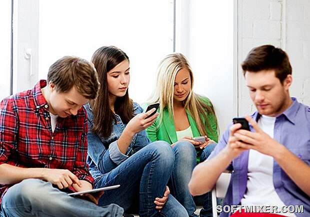 students looking into devices at school