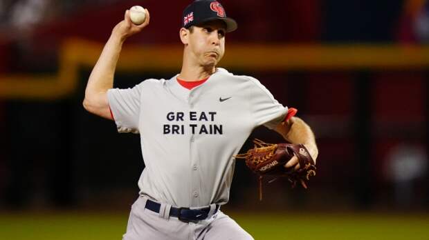 A pitcher winds up for the Great Britain baseball team at the WBC.