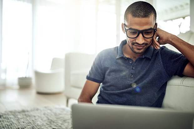 Guy With Glasses Looking At Laptop
