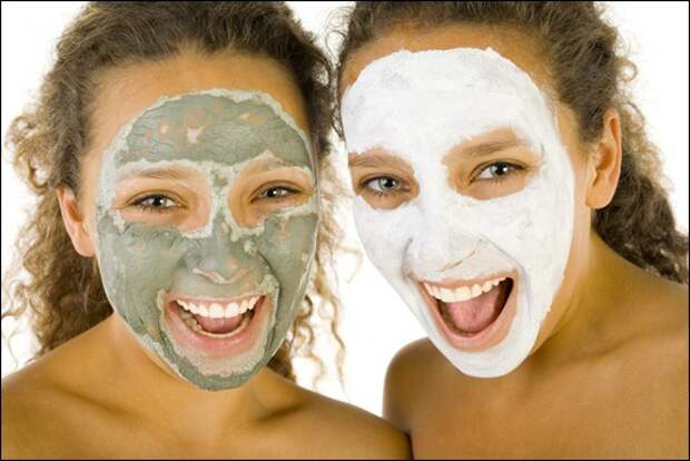 Happy girls with puryfying masks