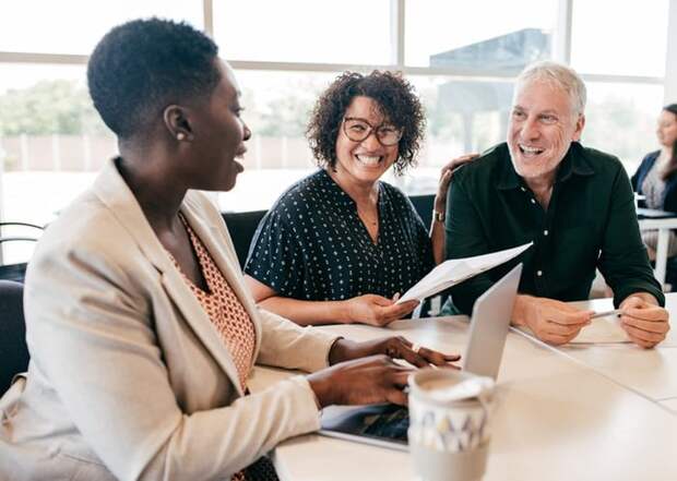 A couple talks to a loan officer