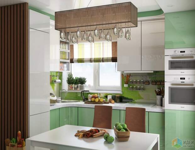 Светло-зеленая кухня, длинный светильник над обеденным столом
