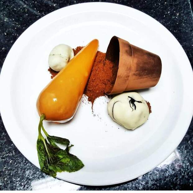 Mirror Glazed Carrot Cake, Edible Stones, Poached Mint, Chocolate Plant Pot.