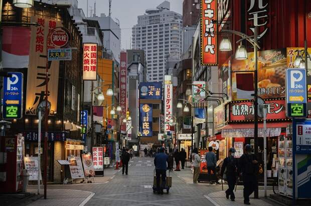 people-walking-on-japan-street-at-nighttime-scaled.jpg