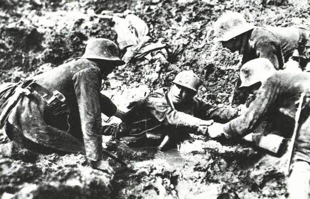 German troops trying to rescue a French soldier from sinking in a mud hole, 1918