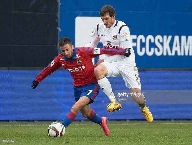 Zoran Toshich of PFC CSKA Moscow challenged by Artyom Fidler of FC Ural Sverdlovsk Oblast during the Russian Premier League match between PFC CSKA Moscow and FC Ural Sverdlovsk Oblast at Khimki Stadium on October 17, 2015 in Moscow, Russia.