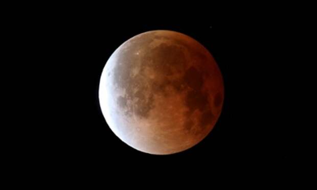 The moon is seen during a total lunar eclipse on 15 April 2014 in Miami, Florida, the first of four ‘blood moons’ in two years