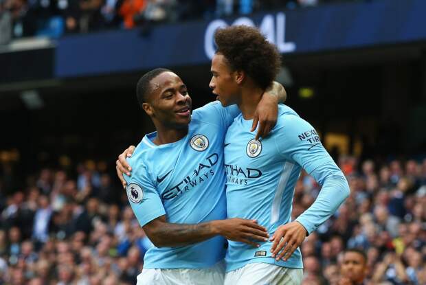 Raheem Sterling (L) of Manchester City celebrates scoring his sides second goal with his team mate Leroy Sane (R)