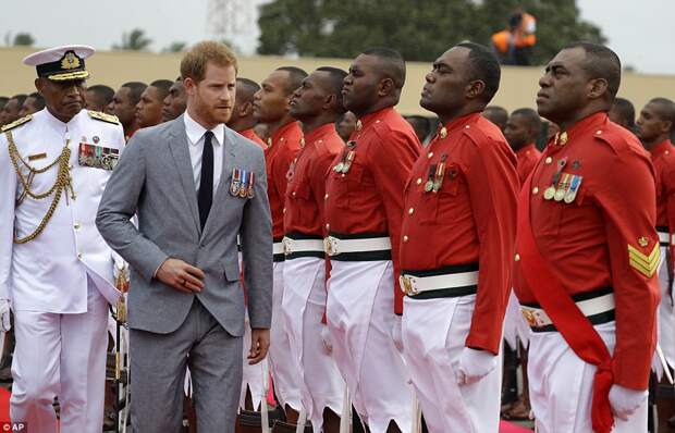 Prince Harry inspects the Guard of Honour which greeted him and his wife Meghan Markle at Fiji's Suva airport on Tuesday afternoon