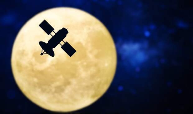Satellite silhouette over a full moon