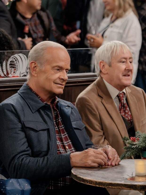 Frasier & Alan sit together at the bar