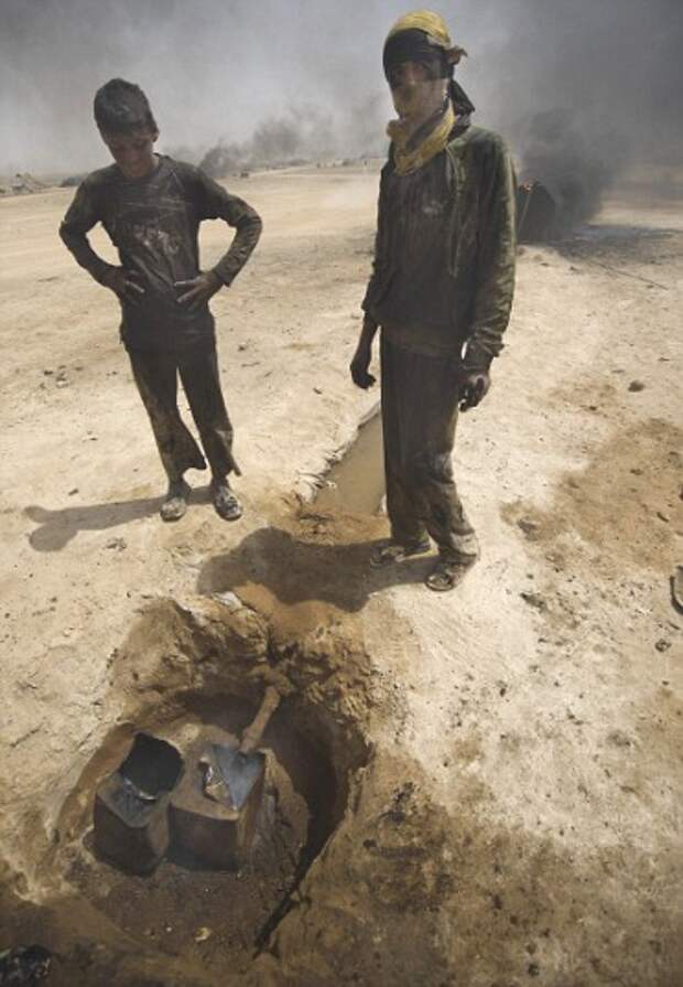 The Oil Stills of Al Mansura,  east of Al Raqqah. A micro industry has grown up around the desert town of Al Mansura in rebel held Northern Sryia, small stills burn oil that is trucked in by the barrel load from the oil fields of Al Hasakah. Each still c