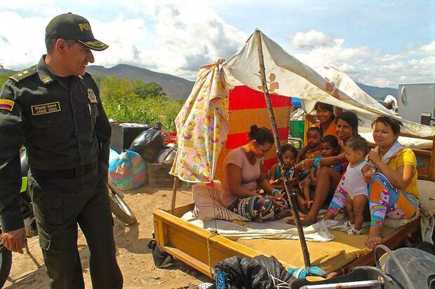 policeman looking over family