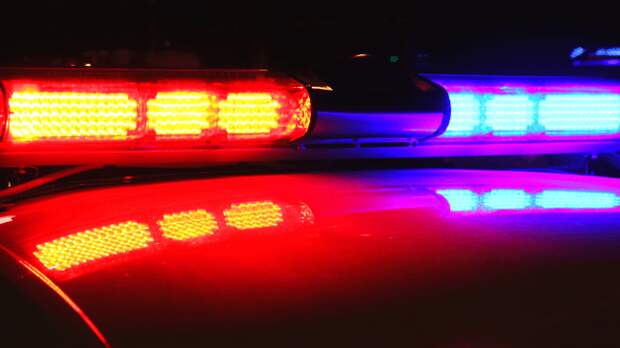 police car lights lit up at night