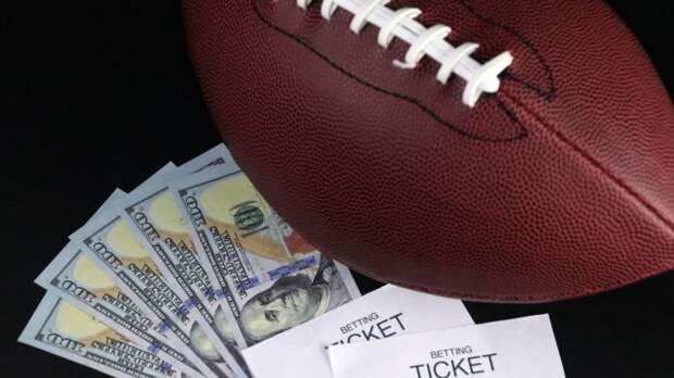 A football next to a betting ticket and