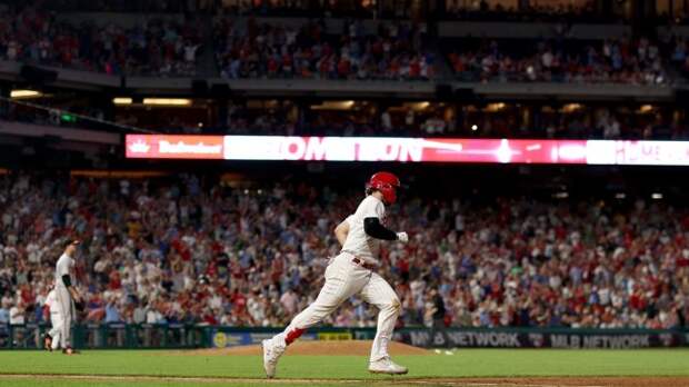 Bryce Harper rounds the bases after hitting a home run.