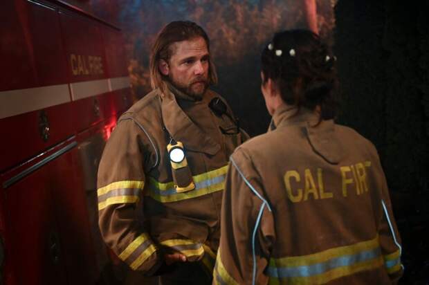 Gabriela and Bode talk in their fire turnouts