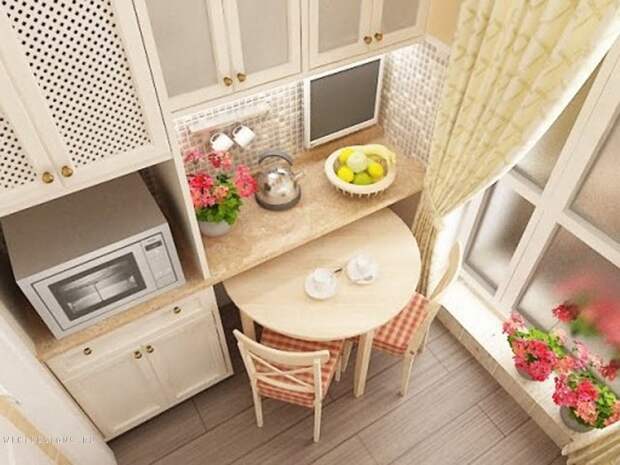 Оптимизация пространства на кухне создана благодаря очень интересному столу необычной формы.