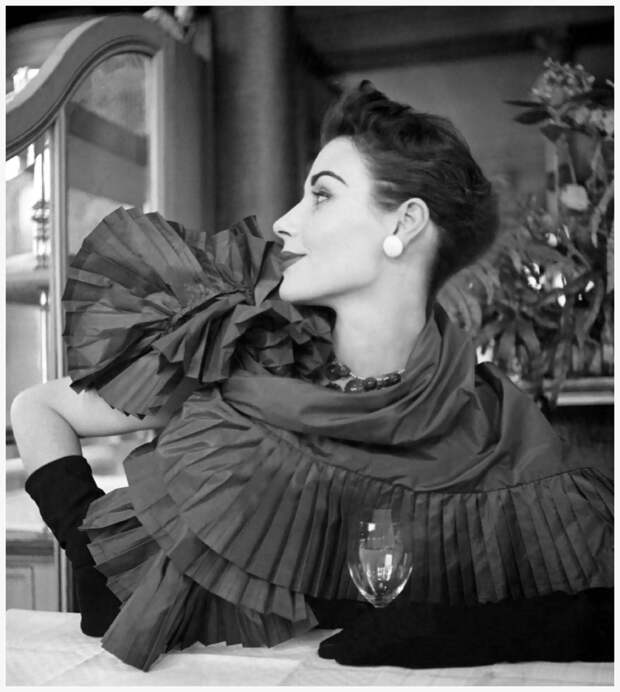 A sculptural oversized shawl in plated taffeta Photo Robert Randall for American Vogue 1952.jpg