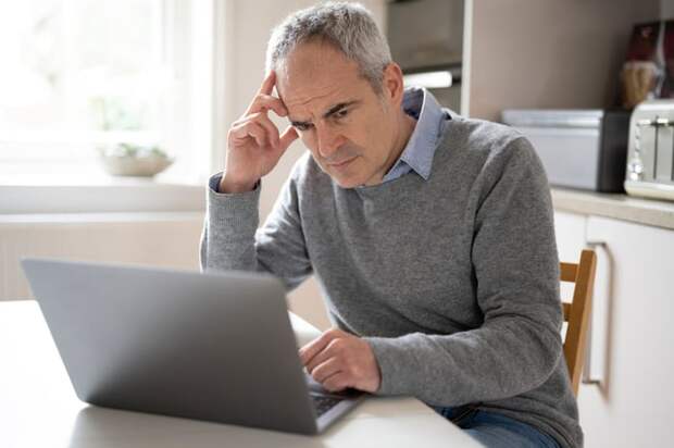 A person at a laptop.