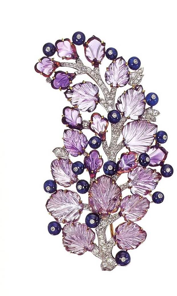 A berry branch made from sculpted amethysts and sapphires in a 'tuttui frutti' style. #purple jewels #amethyst brooch