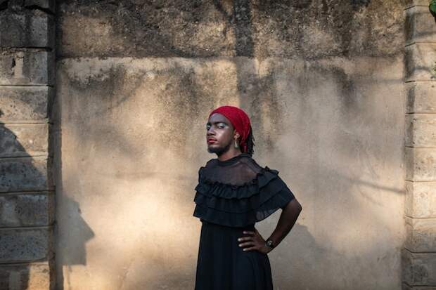 A non-binary Ugandan refugee stands outside the safe house they founded for LGBT refugees in Nairobi, Kenya. This previously unpublished portrait was taken as part of photographer Nichole Sobecki's work on how the coronavirus was affecting Kenya in 2020.