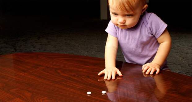 toddler reaching for pills