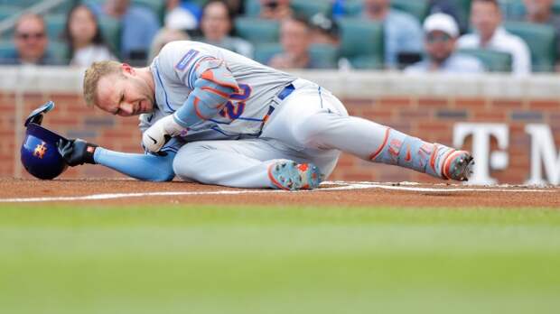 Pete Alonso falls to the ground after being hit by a pitch.