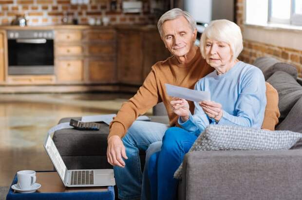 Two people looking at a check.