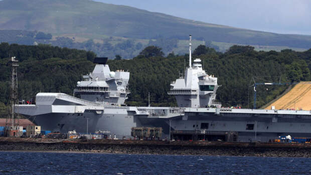 HMS Queen Elizabeth sits docked in the sunshine at Rosyth dockyard