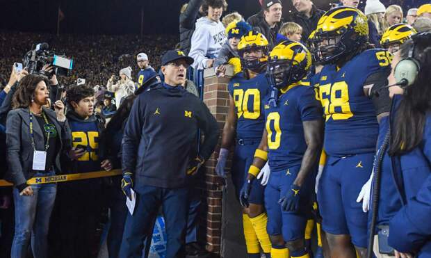 Jim Harbaugh Mazi Smith take the field