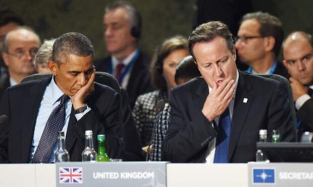David Cameron and Barack Obama as Cameron makes a statement at the opening of this morning's Nato session