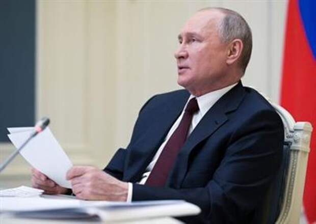 Russian President Vladimir Putin delivers a speech during a virtual global climate summit via a video link in Moscow, Russia April 22, 2021. Sputnik/Alexei Druzhinin/Kremlin via REUTERS ATTENTION EDITORS - THIS IMAGE WAS PROVIDED BY A THIRD PARTY.